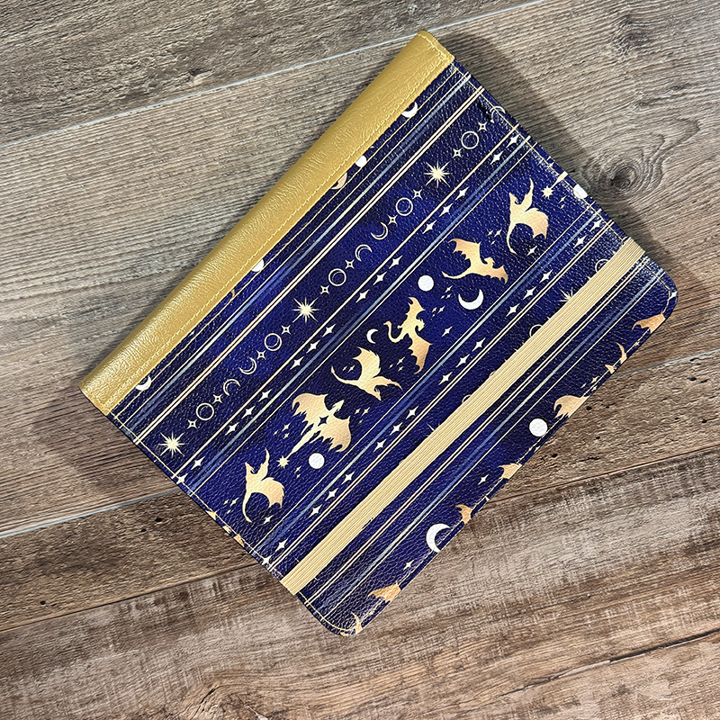 notepad holder featuring columns of dragons in flight